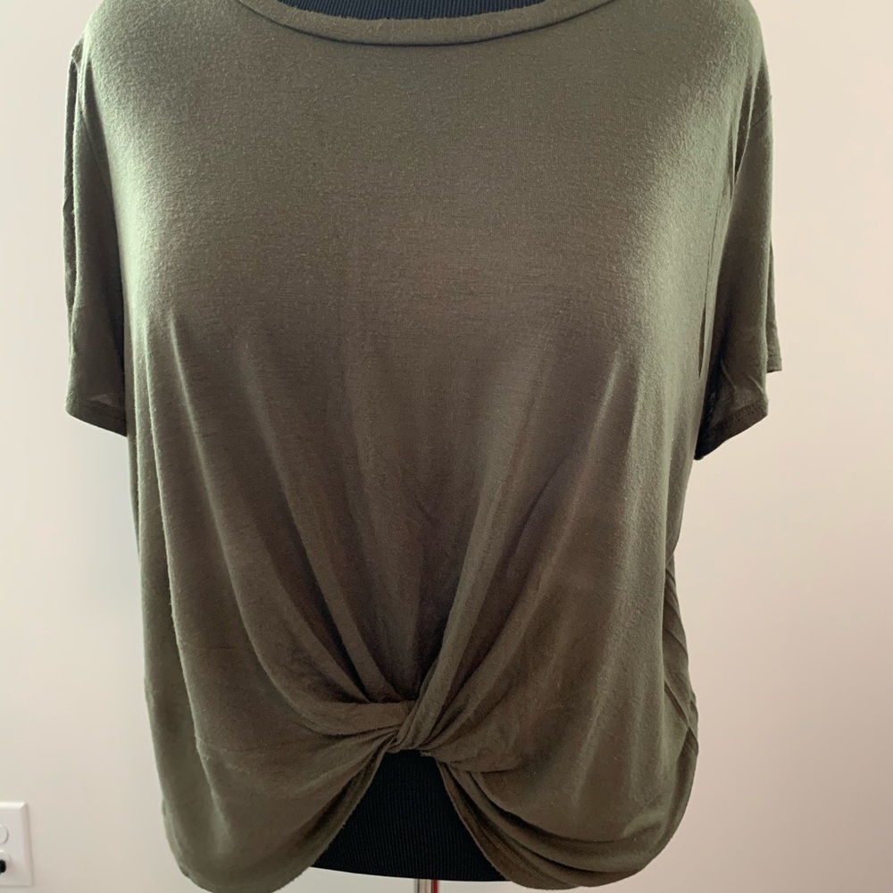 Super cute olive green shirt with a knot in front.